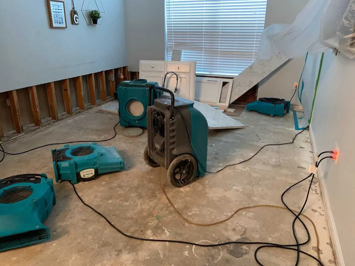 Dehumidifier in flood-cut room for Water Damage Restoration in Hillside